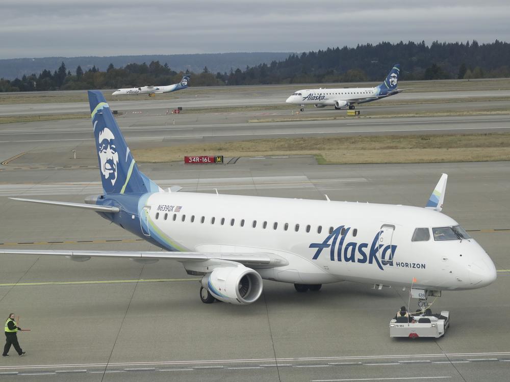 An Alaska Airlines plane, like this one operated by Horizon Air, had to divert to Portland, Ore. on Sunday after an off-duty pilot tried to turn off the engines in flight.
