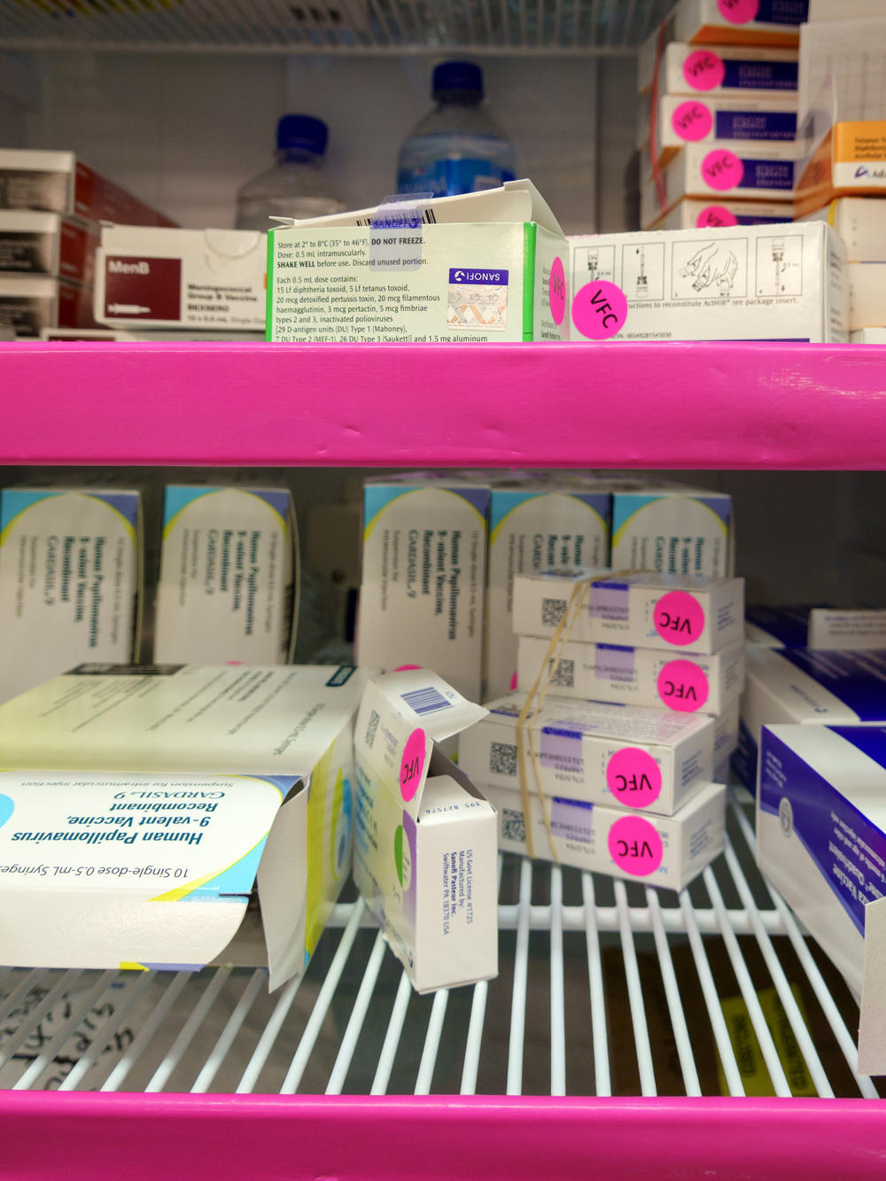 A refrigerator at Mid-Valley Children's Clinic in Albany, Oregon with supplies of government-funded vaccines for children on Medicaid. The pink 