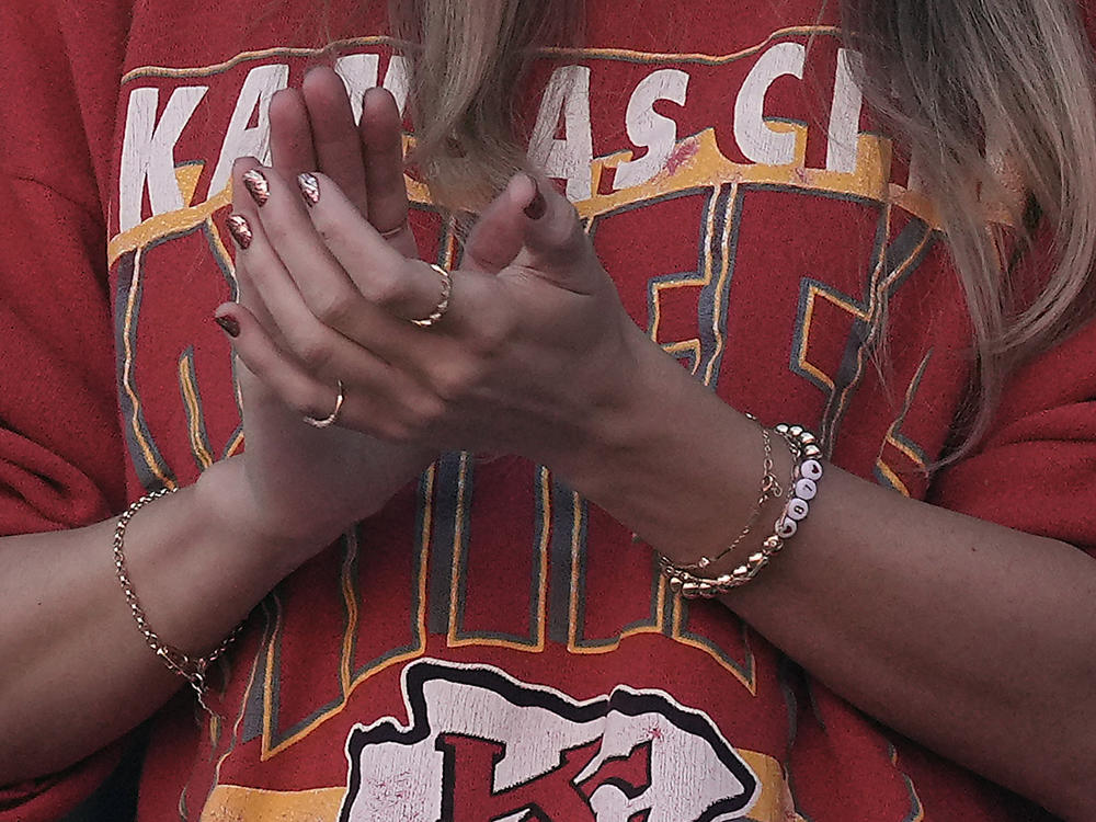 Taylor Swift wears a friendship bracelet with Kansas City Chiefs tight end Travis Kelce's number 87 while watching a game between the Kansas City Chiefs and the Los Angeles Chargers on Oct. 22, 2023, in Kansas City, Mo.