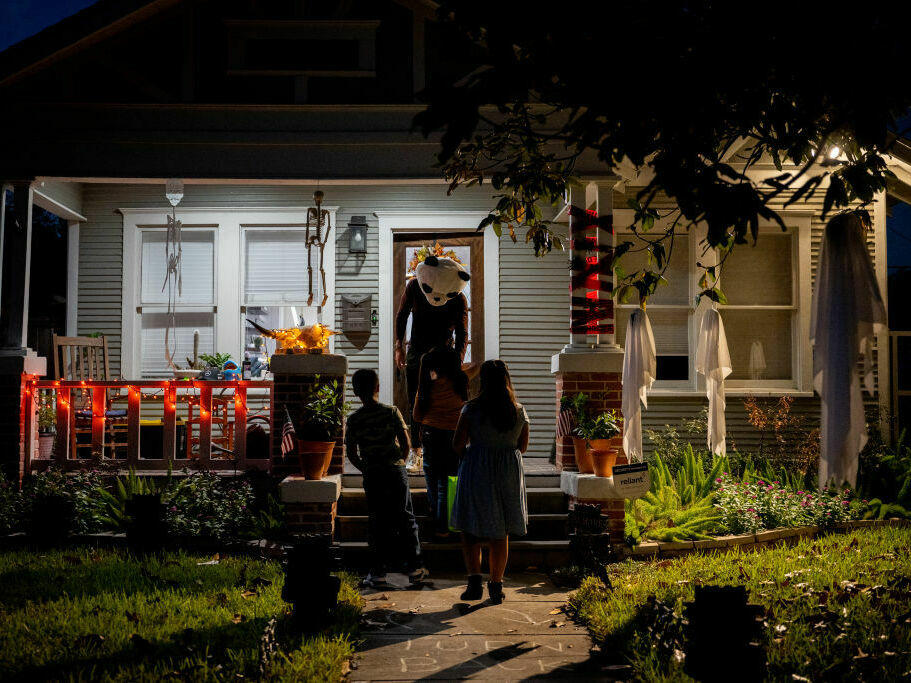 Children go trick-or-treating on Oct. 31, 2022, in Houston.