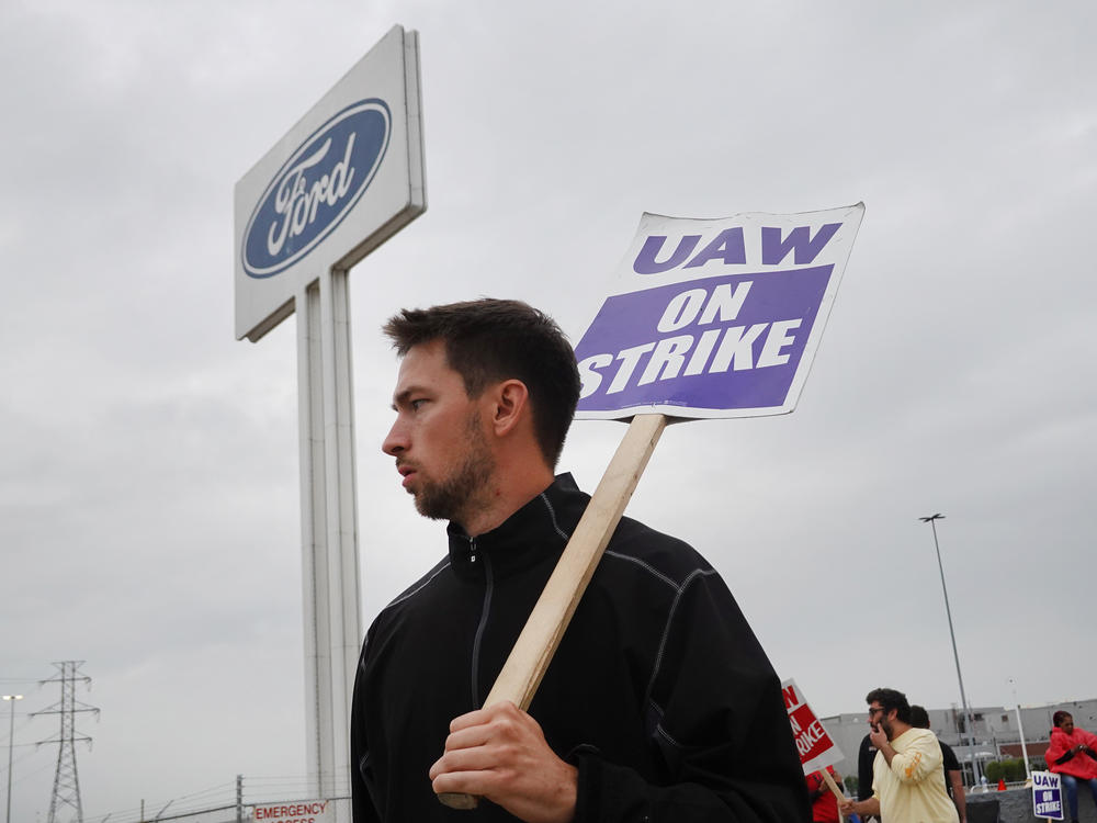 UAW workers picket outside of Ford's Wayne Assembly Plant in Wayne, Mich., on Sept. 26, 2023. The union and Ford reached a tentative agreement on Wednesday, in a major potential development in the ongoing strike against the Big Three automakers.