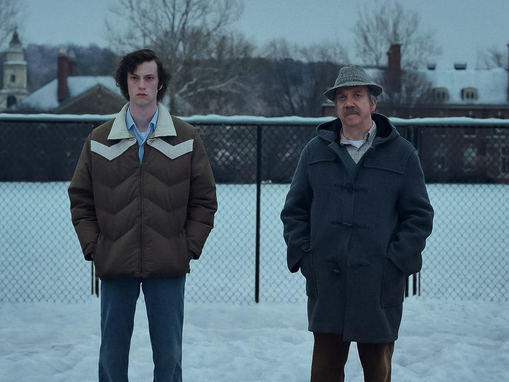 Dominic Sessa stars as Angus Tully and Paul Giamatti is Paul Hunham in Alexander Payne's <em>The Holdovers.</em>