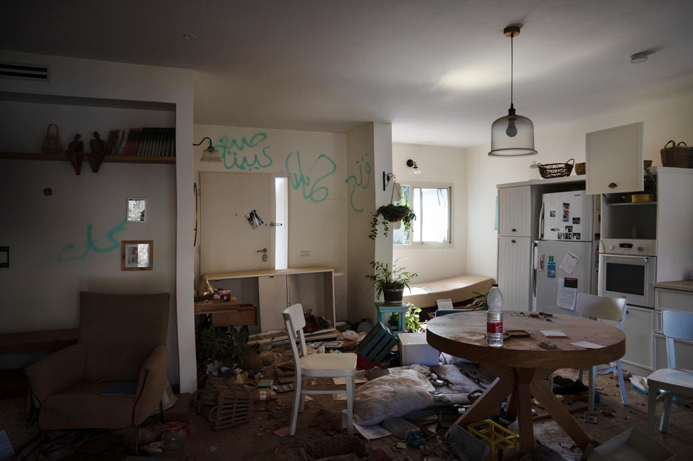 A destroyed home is seen in Kibbutz Be'eri, a community that was attacked by Hamas militants almost three weeks ago near the Israeli-Gaza border. Graffiti left by the attackers can be seen on the walls of the home.