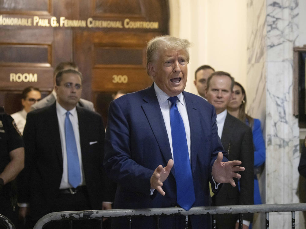 Former President Donald Trump speaks to the media as he exits the courtroom of his civil business fraud trial at New York Supreme Court on Wednesday.