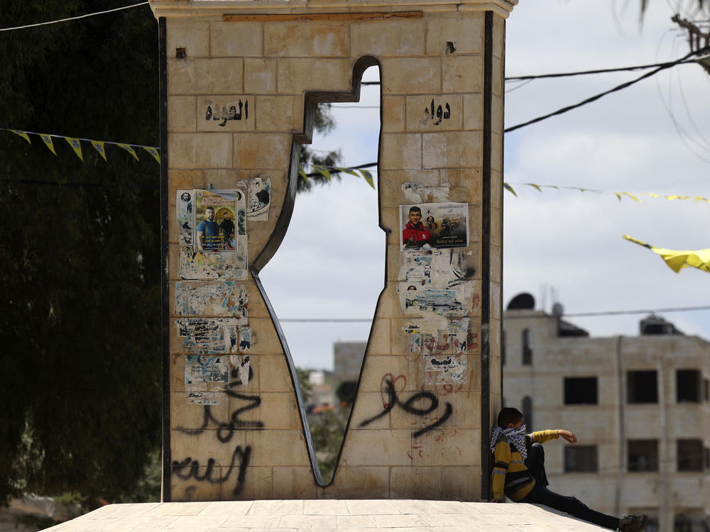 A monument in the West Bank town of Jenin bears the outline of Mandatory Palestine.