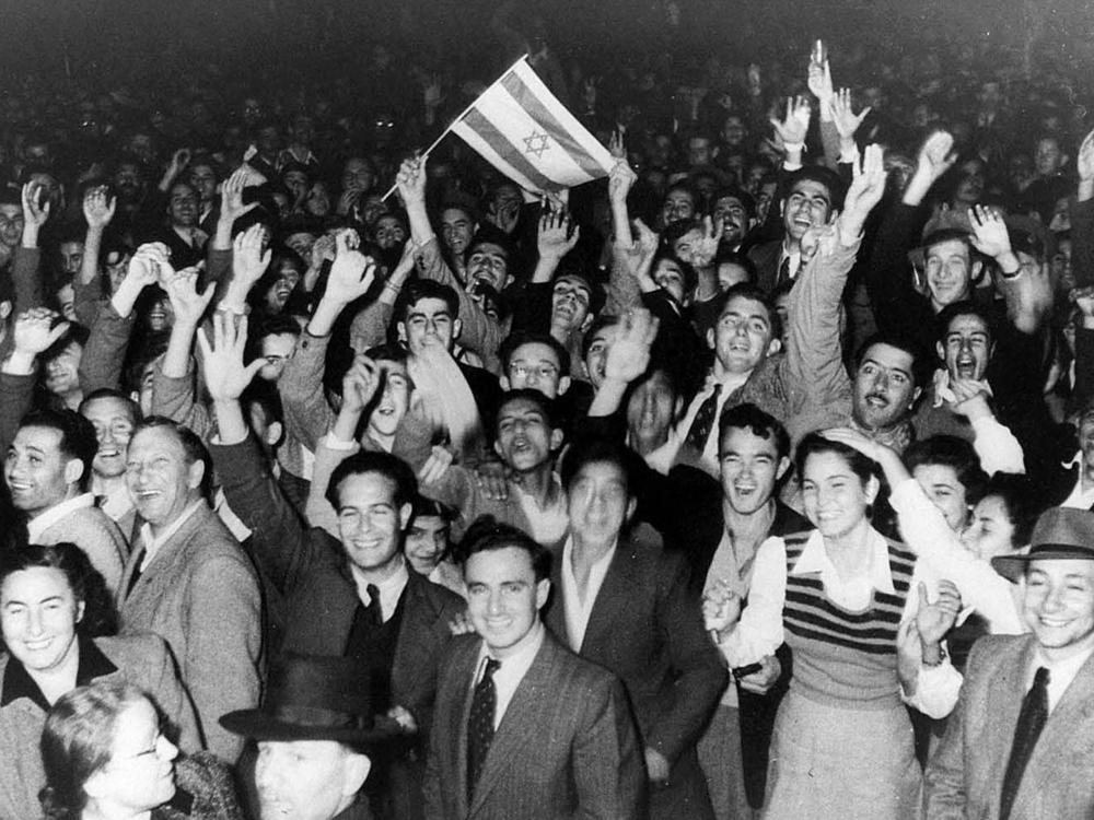 Tel Aviv residents celebrate the U.N. decision to create a Jewish state by dividing Palestine into two states on Nov. 29, 1947.