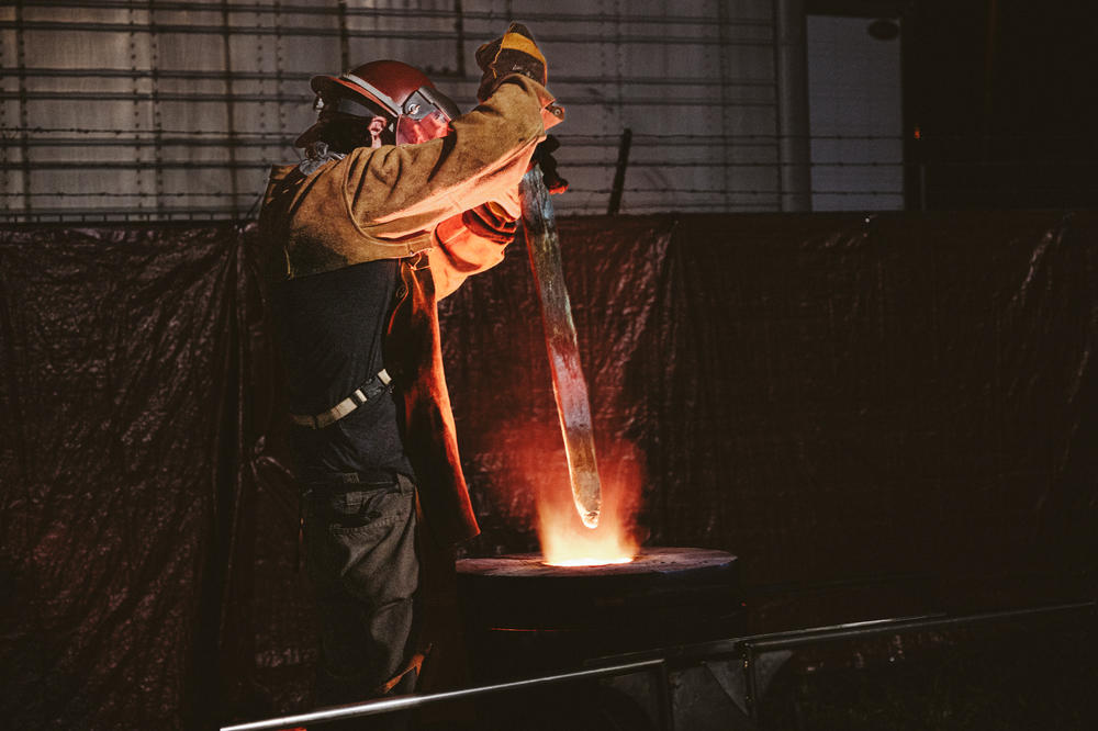 The saber from Confederate Gen. Robert E. Lee's statue is plunged into a crucible to be melted down.