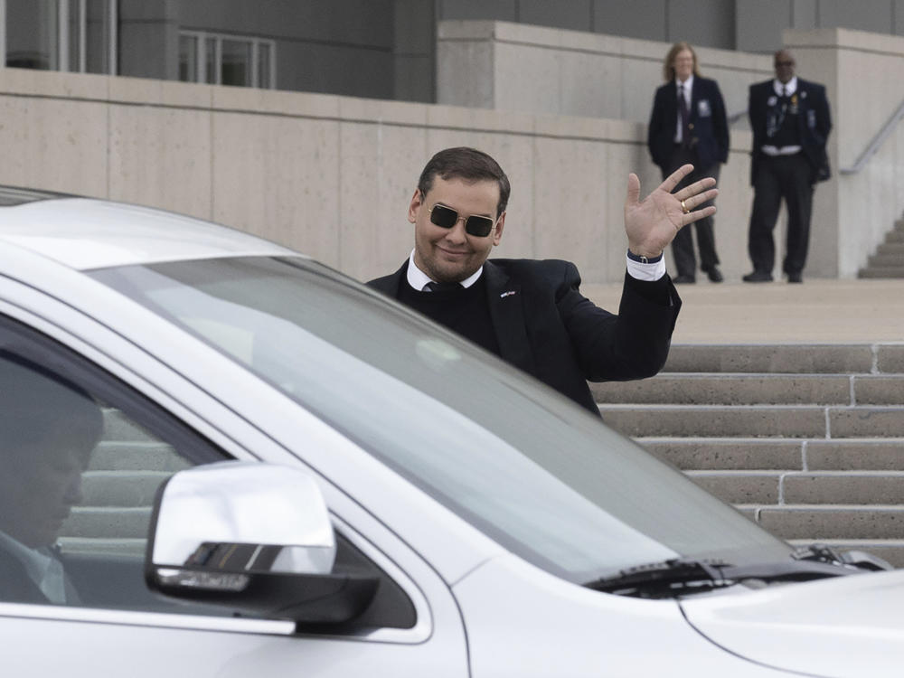 U.S. Rep. George Santos leaves the federal courthouse in Central Islip, N.Y., on Friday after pleading not guilty to charges in a revised indictment.