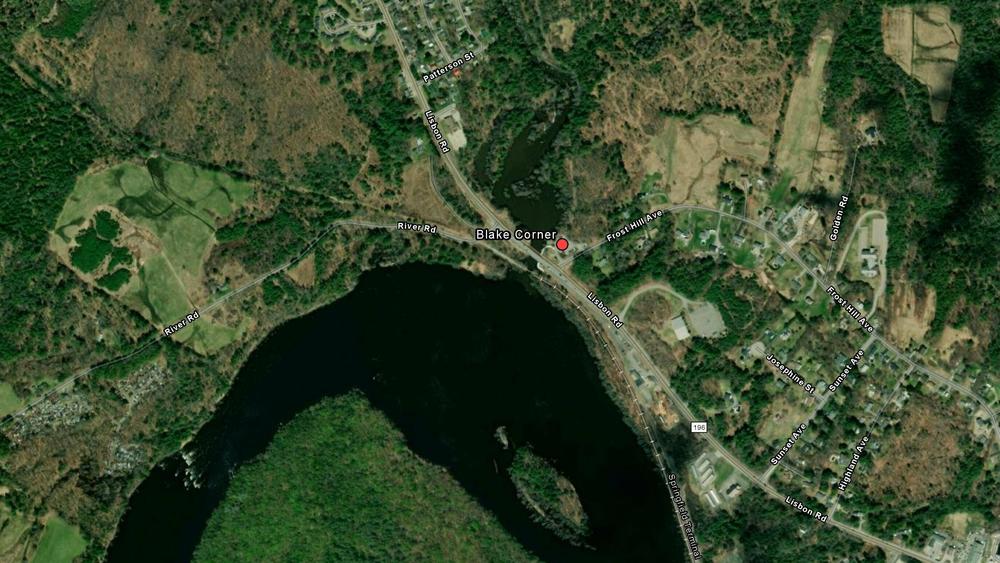 A map displayed by Lewiston law enforcement official of the boat ramp, marked by a red dot, at the Androscoggin River where a car registered to the suspect was found.