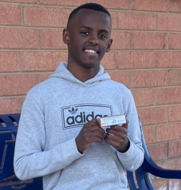 Heman Bekele with his cancer-fighting soap. With roots in Ethiopia, Bekele was inspired to take on skin cancer and to help under-resourced countries.