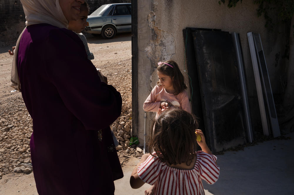 Sarah Zakarneh, 5, and her family live around the corner from the Al-Ansar Mosque. The family was sleeping when the airstrike hit and after waking up they fled to a family member's house outside of town.