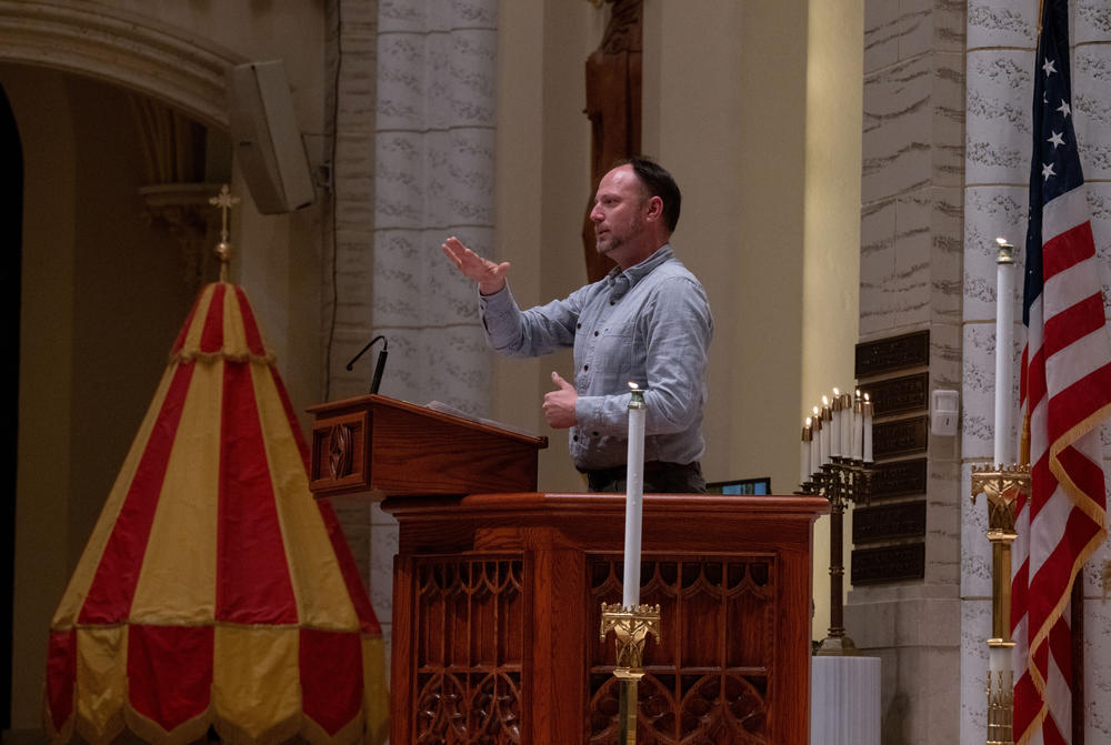 Kevin Bohlin, a member of the deaf community, delivers remarks in American Sign Language.