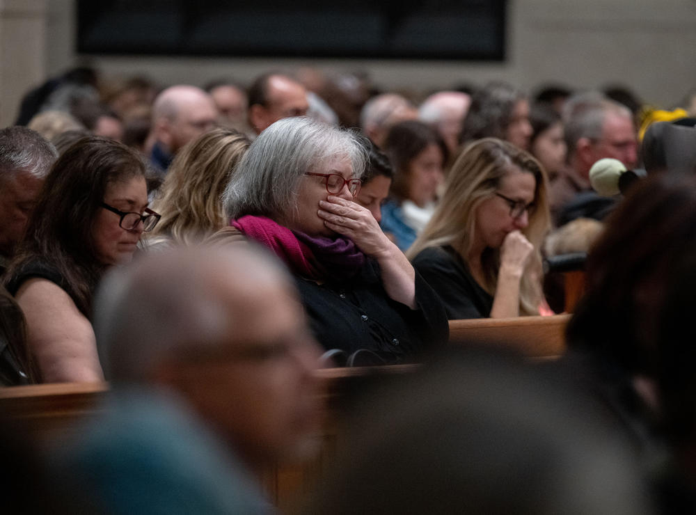 Attendees listen to speakers in the Basilica of Saints Peter and Paul in Lewiston, Maine.