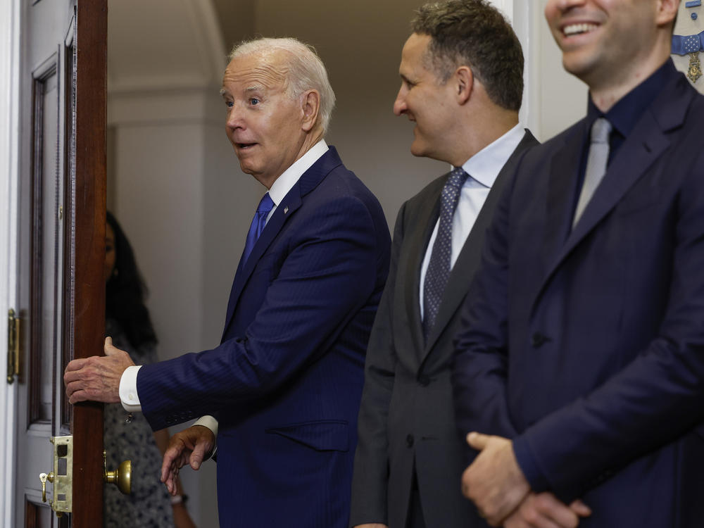 President Biden, seen here at a meeting with leaders of AI companies at a White House meeting on July 21. The White House first worked on voluntary commitments, but the new action goes beyond that.