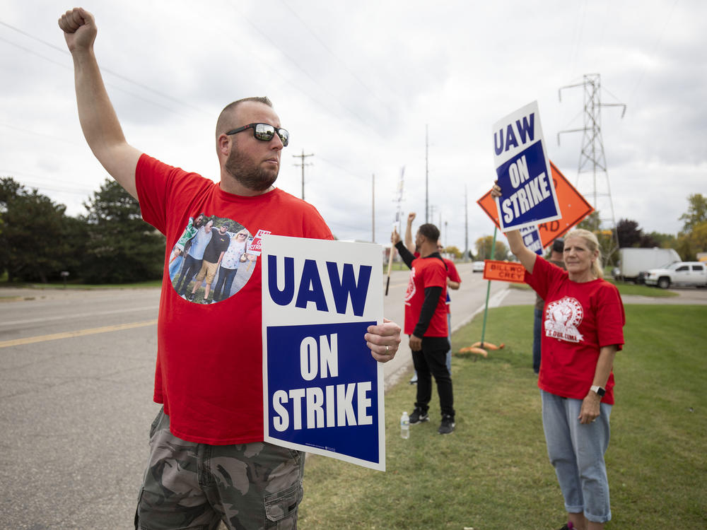 UAW members strike the General Motors Lansing Delta Assembly Plant in Lansing, Mich., on Sept. 29, 2023. The UAW clinched a deal with GM more than six weeks after the start of the auto strike.