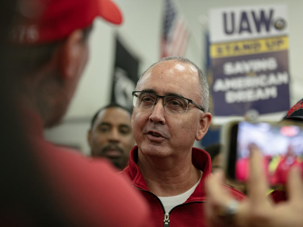 UAW President Shawn Fain greets members attending a rally in support of the labor union strike in Chicago on Oct. 7, 2023. The deals clinched with the Big Three automakers still need to be ratified by the union's members.