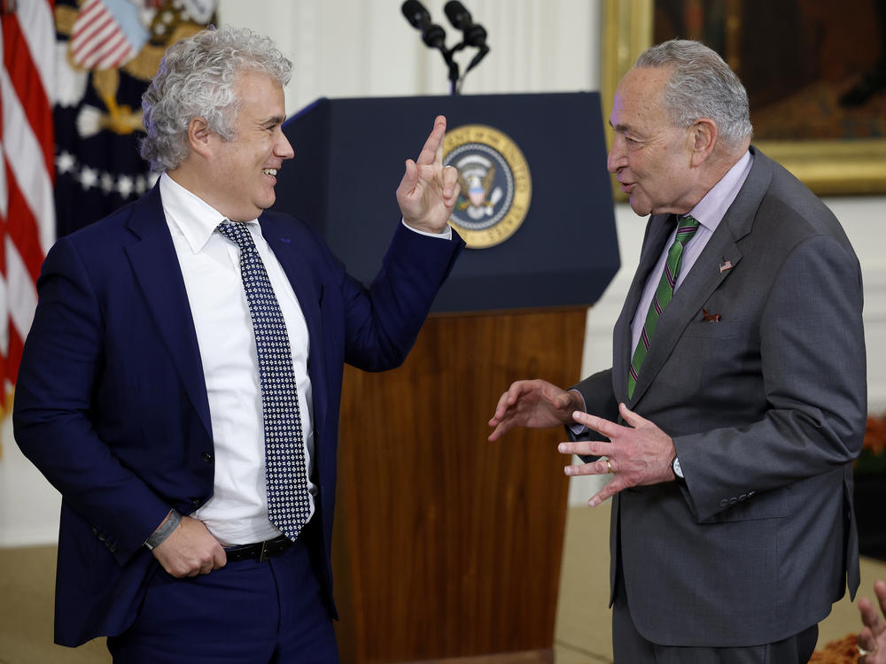 White House chief of staff Jeff Zients talks with Senate Majority Leader Chuck Schumer at a White House event on artificial intelligence on Oct. 30.