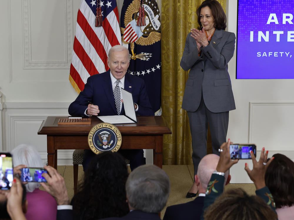 President Biden signs a new executive order on artificial intelligence on Oct. 30. Vice President Harris will talk about the order in London with world leaders this week.