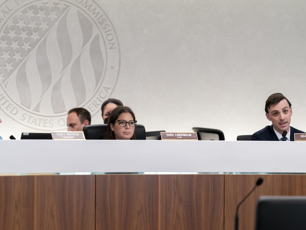 Chair of the Federal Election Commission Dara Lindenbaum, center, listens during an Aug. 10 FEC public meeting on whether it should regulate the use of AI-generated political campaign advertisements.