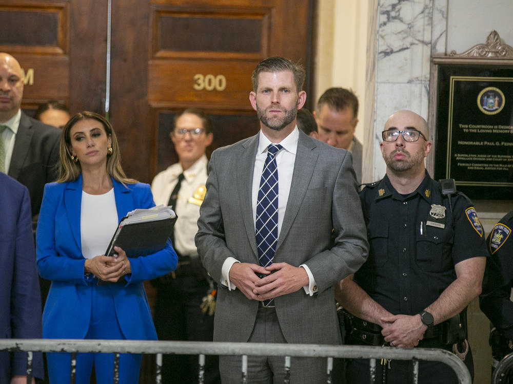 Eric Trump stands in the hallway outside the New York City courtroom where his family's civil fraud case is underway, on Oct. 25.