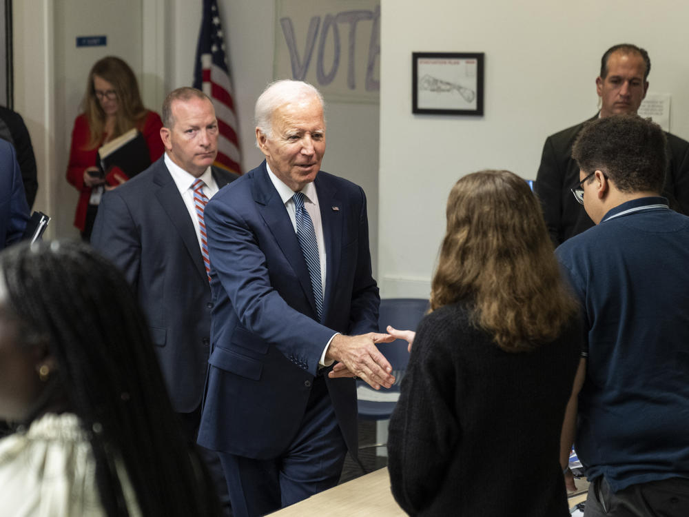 President Biden greets Democratic National Committee staff and volunteers after speaking at DNC headquarters in Washington, D.C., on Oct. 24.