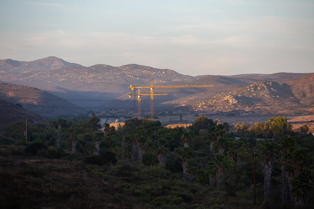 A development of almost 3,000 homes planned for a valley in Santee, Calif., has ignited a debate in the community about housing and wildfire risk.