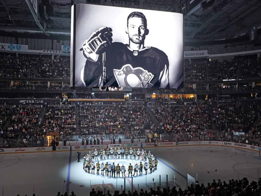 Players from the Pittsburgh Penguins and Anaheim Ducks on Monday honored former Penguin player Adam Johnson, who died during a game in England. The Penguins are making neck guards mandatory for players at the minor-league level, and will also urge NHL players to wear them.