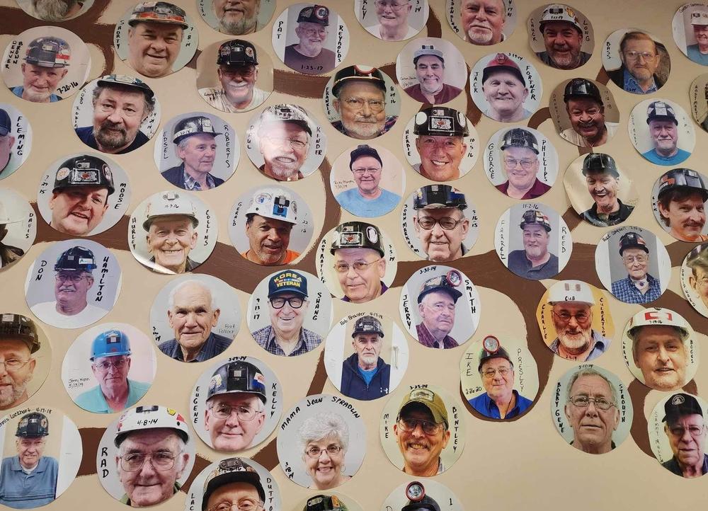 A wall of photos of miners with complicated black lung who received respiratory therapy at New Beginnings Pulmonary Rehab in Norton, Va.