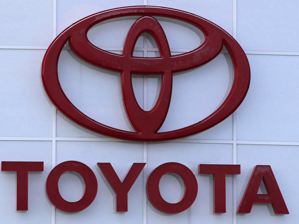 The Toyota logo is seen on a dealership, Aug. 15, 2019, in Manchester, N.H. Toyota said Wednesday, Nov. 1, 2023, that it is recalling nearly 1.9 million RAV4 small SUVs in the U.S. to fix a problem with batteries that can move during forceful turns and potentially cause a fire.