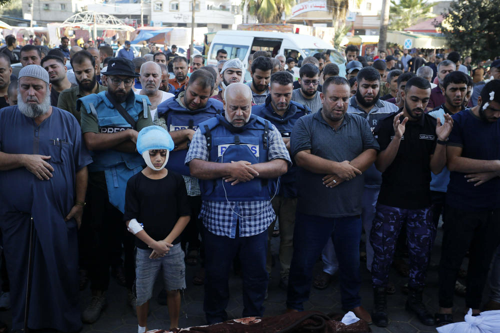 Al Jazeera journalist Wael Al-Dahdouh attends the funeral of his wife, son and daughter, after their home was hit in the Nuseirat camp in the center of Gaza, where they had sought refuge after being displaced by the initial bombardment in their neighborhood, Oct. 26.