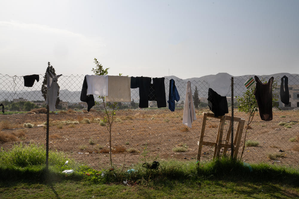 Laundry hangs from a fence outside a university campus in the Palestinian city of Jericho, at a makeshift home for more than 400 workers from Gaza. There are thousands more workers throughout the Israeli-occupied West Bank, including in the city of Ramallah.