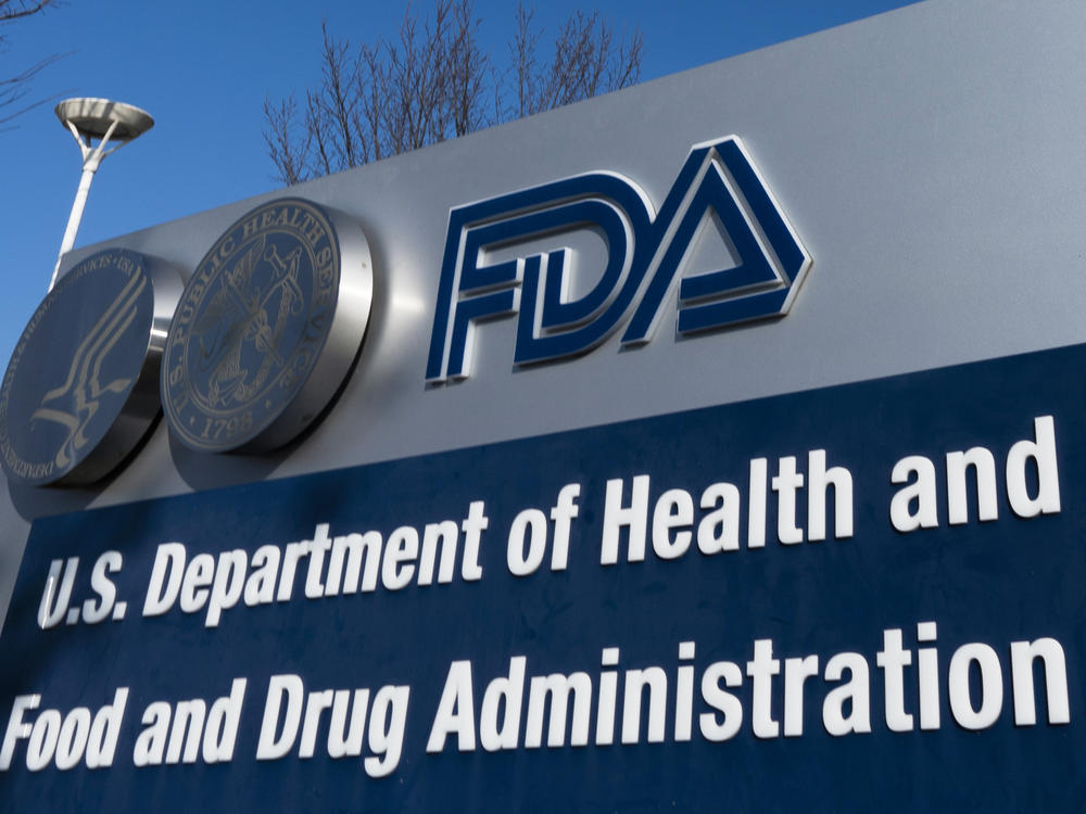 A sign for the U.S. Food and Drug Administration is displayed outside its offices in Silver Spring, Md., on Dec. 10, 2020. The FDA says it's considering banning brominated vegetable oil, a food additive.