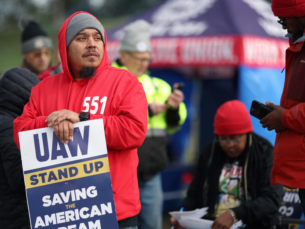 Workers picket outside a Ford plant in Chicago on Oct. 10, 2023. The U.S. created 150,000 jobs in October, marking a slowdown from the previous month, partly as a result of the UAW strikes.