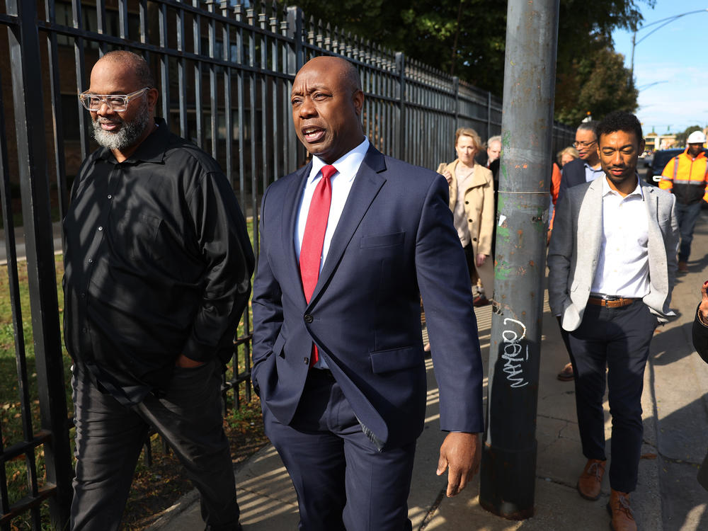 Republican presidential candidate Sen. Tim Scott takes a brief tour of the Woodlawn neighborhood with Pastor Corey Brooks before speaking at Brooks' New Beginnings Church last month in Chicago, Ill.