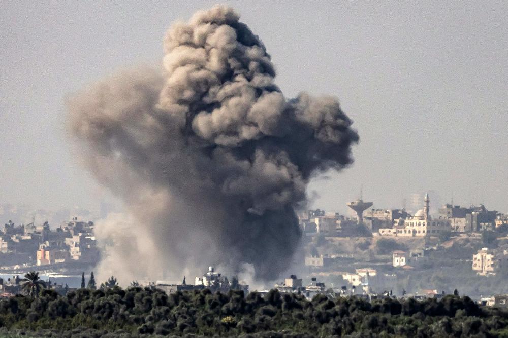 This picture taken on Friday from a position along the border between the Gaza Strip and southern Israel shows a smoke plume erupting during Israeli bombardment.
