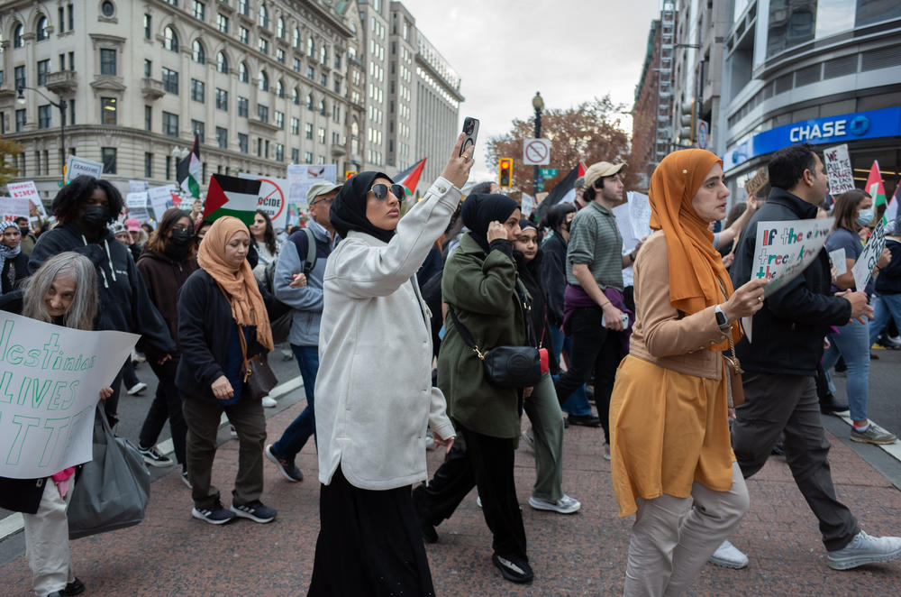 Protesters march through Washington, D.C., on Saturday. U.S. officials have so far stopped short of demands for a cease-fire, but pressed Israel on Friday for a 