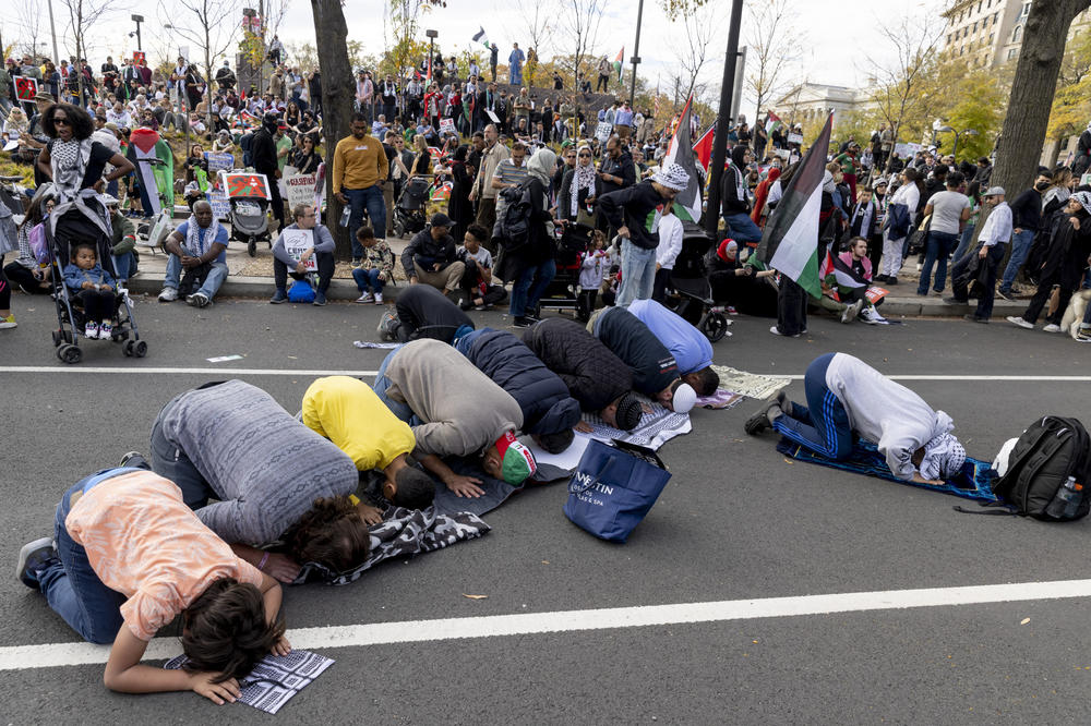 People pause to pray during the rally. Protesters came from across the country to join the rally.