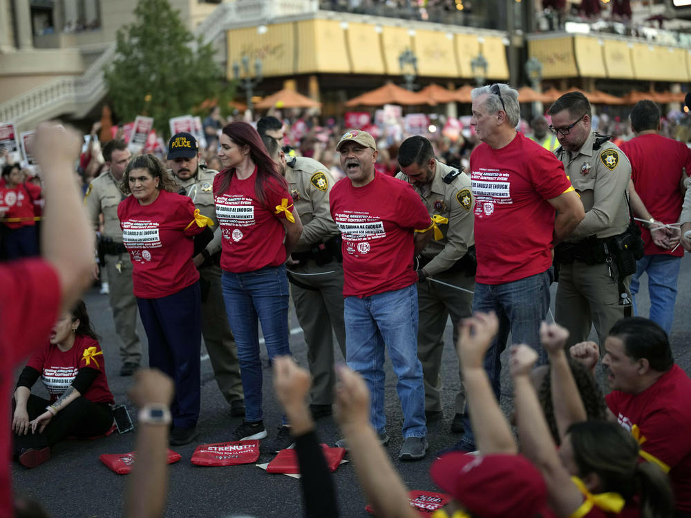 Las Vegas police arrest members of the Culinary Workers Union during a rally along the Strip on Oct. 25 in Las Vegas.