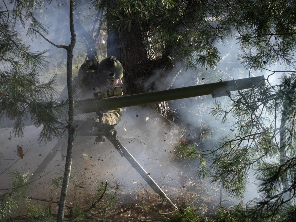 Ukrainian National Guard soldiers fire a recoilless cannon during combat training at a military training ground in northern Ukraine on Friday, Nov. 3, 2023.