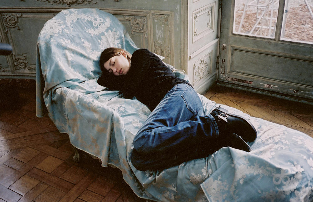 Sofia Coppola naps on the set of her 2003 film,<em> Marie Antoinette.</em>