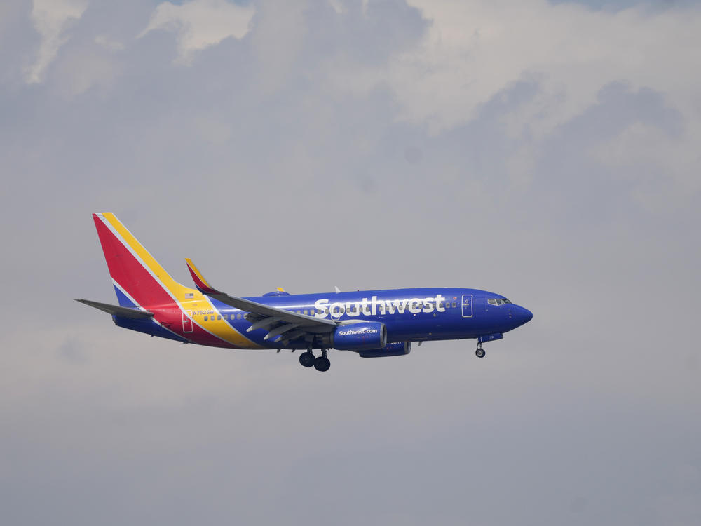 A Southwest Airlines jetliner approaches Denver International Airport on May 26. The airline has spent months preparing for the holiday travel season after a meltdown last December that left thousands stranded.