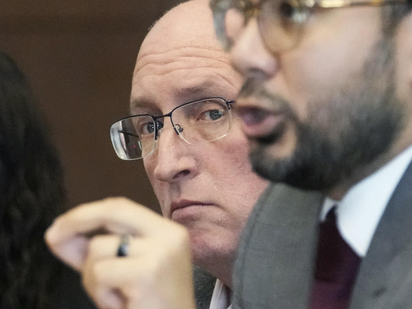 Robert E. Crimo Jr., left, listens Friday to his attorney George Gomez while he speaks to Judge George D. Strickland during an appearance at the Lake County Courthouse in Waukegan, Ill.