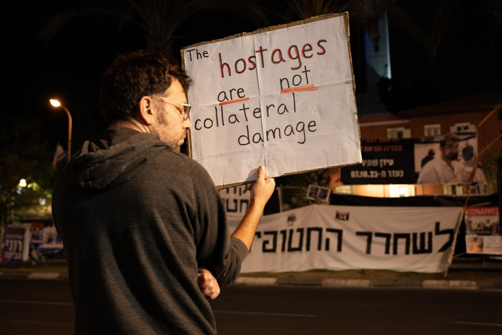 Roughly 240 hostages were taken prisoner inside Gaza during the deadly Hamas massacre of some 1,400 people in southern Israel on Oct. 7. Above, an Israeli man protests outside a ministry of defense base in Tel Aviv.