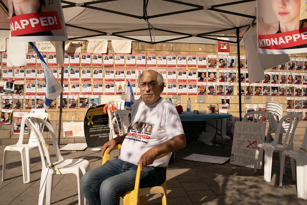Shmuel Broduch poses for a portrait in a tent he has set up outside of the ministry of defense base in Tel Aviv on Nov. 5. He wants Israel to strike a deal with Hamas for the release of his three young grandchildren and daughter-in-law.
