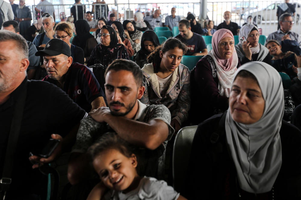 Citizens with foreign passports wait to travel through the Rafah crossing on Nov. 2 in Rafah, Gaza.