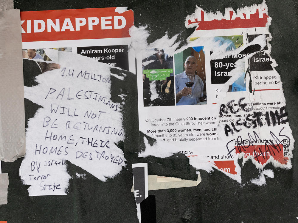 Posters hung around the New York University campus in Greenwich Village, showing people kidnapped by Hamas on Oct. 7 in Israel, are seen torn up and covered with pro-Palestinian graffiti.