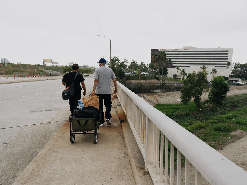 HOPICS outreach workers head back to their vans after visiting a tent encampment.