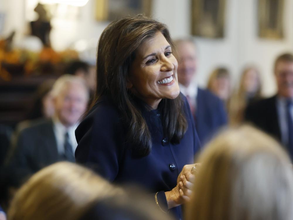 Former U.N. Ambassador Nikki Haley greets supporters after signing papers to get on the Republican presidential primary ballot at the New Hampshire Statehouse on Oct. 13 in Concord, N.H.