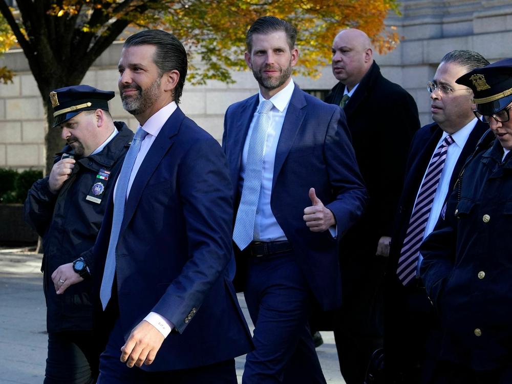 Donald Trump Jr. (2nd L) and Eric Trump (C) arrive at New York Supreme Court earlier this month for the fraud trial of the Trump Organization.