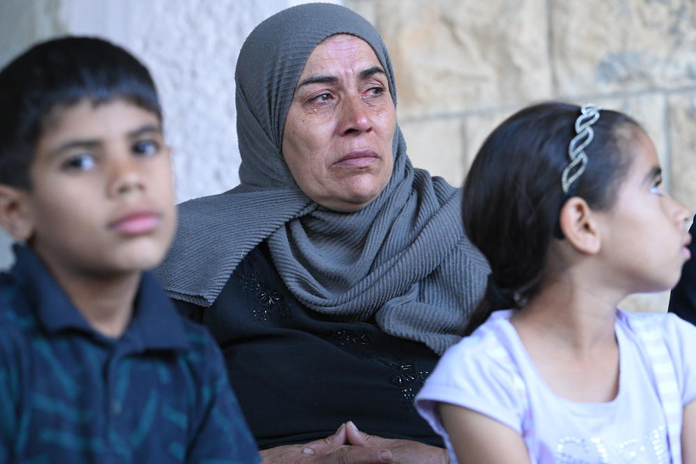 Bilal's mother-in-law and kids outside their home on Oct.31, 2023.